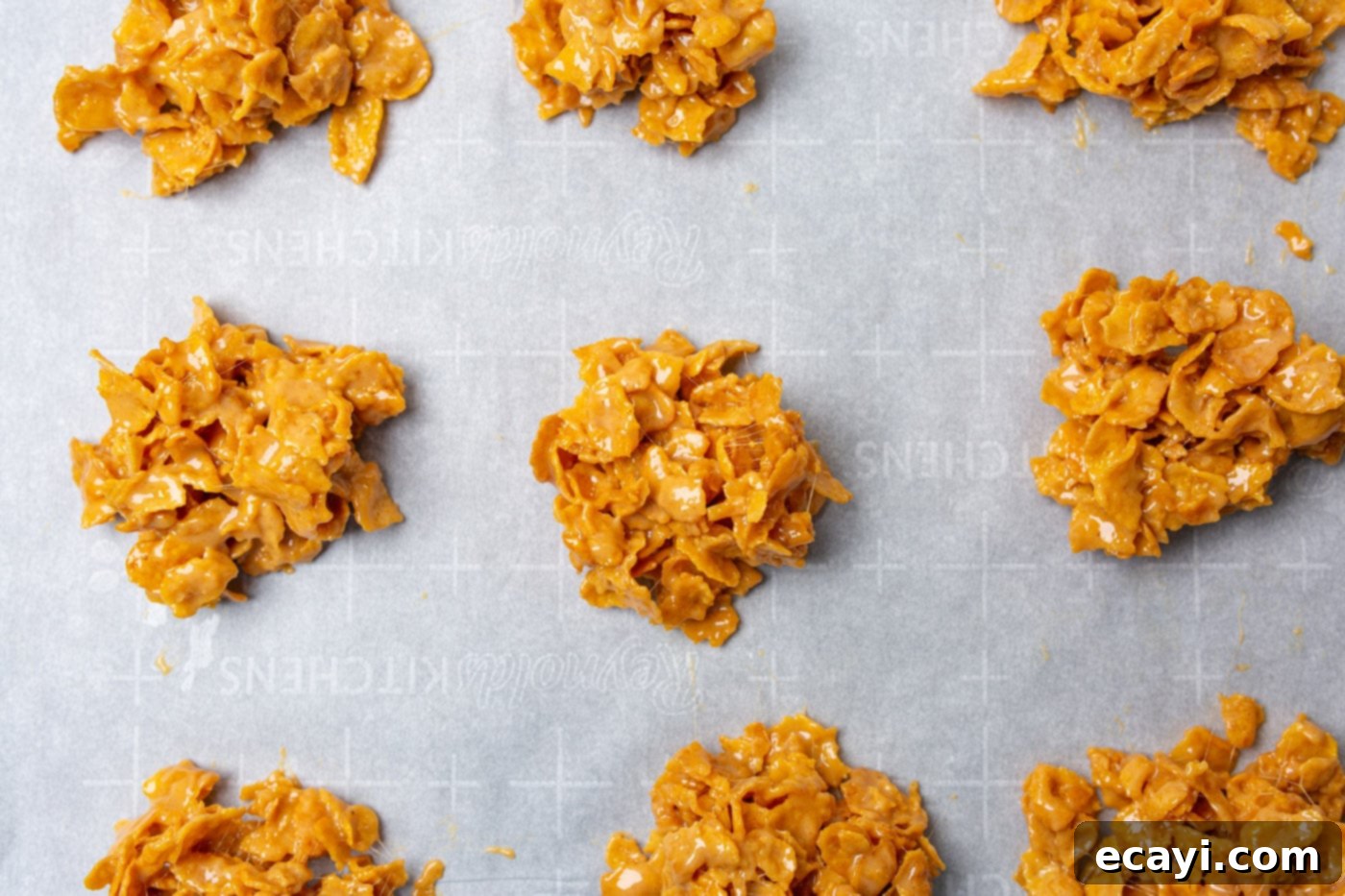 Crunchy Peanut Butter Clusters 8 peanut butter cornflake cookies on baking sheet