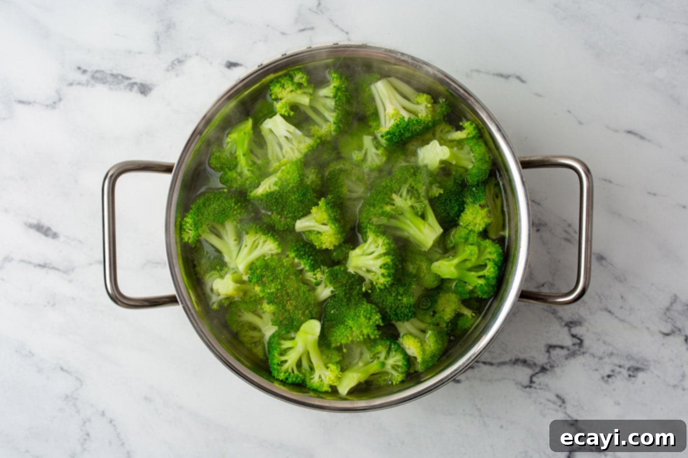 Cheesy Broccoli Bake 5 blanching broccoli in a pot