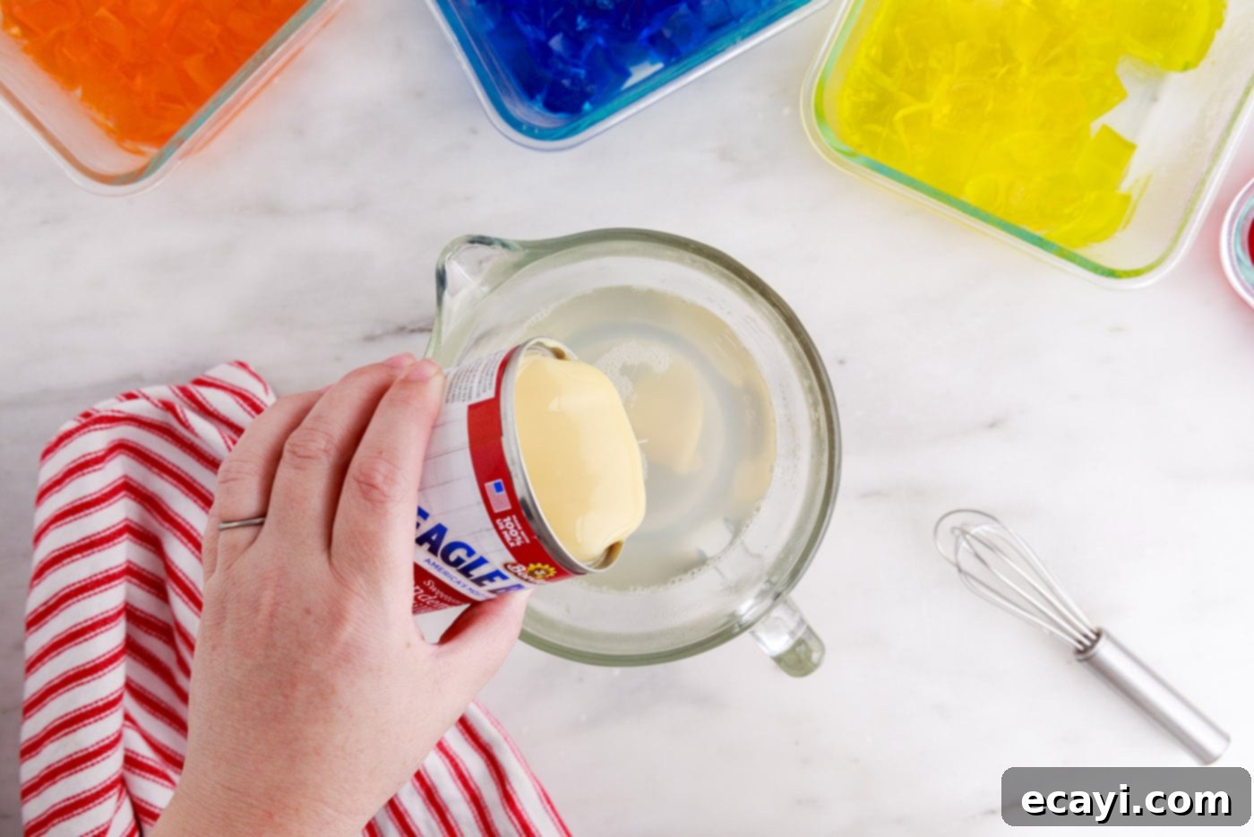 Mosaic Jello Jewels 10 pouring sweetened condensed milk into gelatin