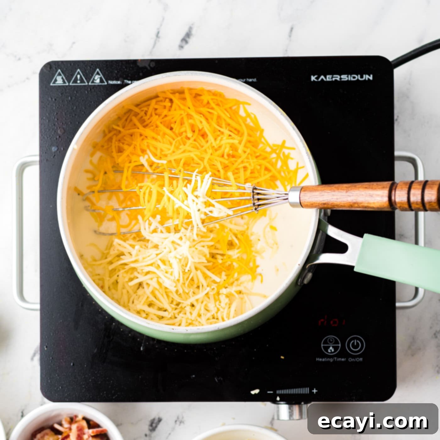 Golden Cauliflower Bake 7 stirring cheese into sauce