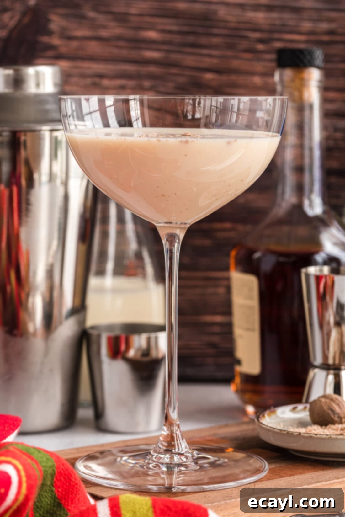 Velvet Cocoa Indulgence 2 A classic Brandy Alexander cocktail presented elegantly in a chilled martini glass, garnished with freshly grated nutmeg.