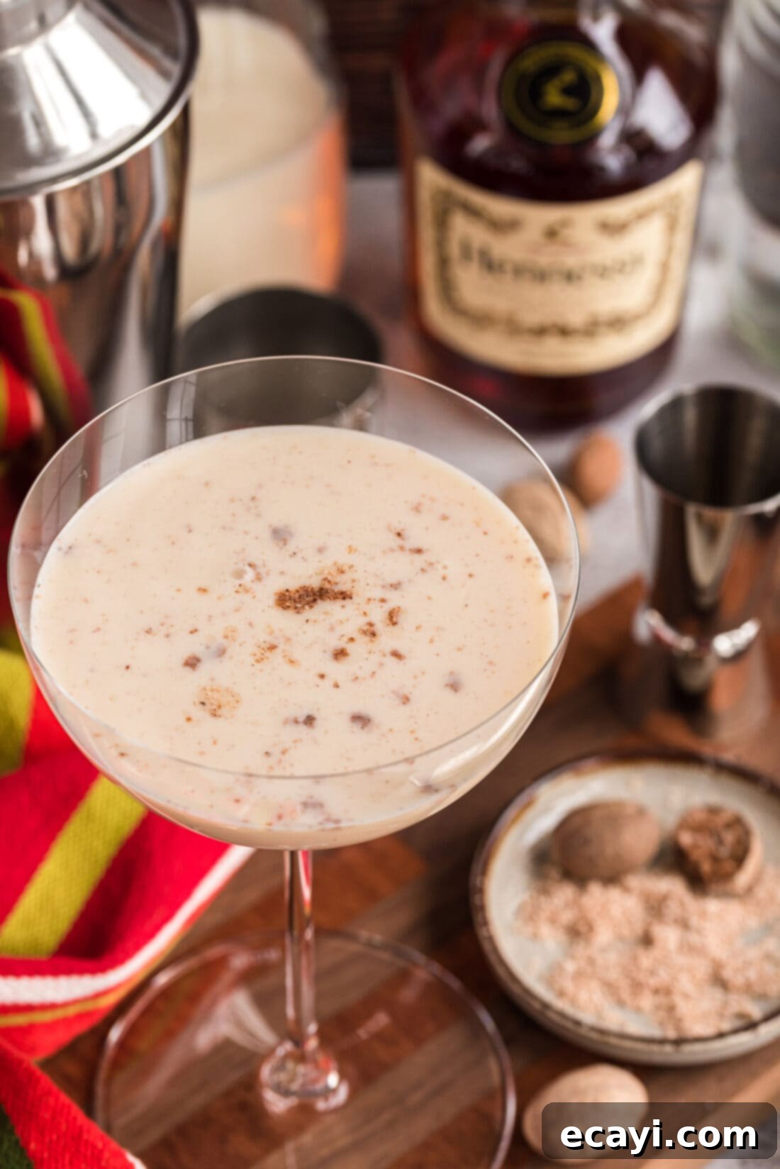 Velvet Cocoa Indulgence 3 A close-up shot of a Brandy Alexander cocktail topped with a generous sprinkle of freshly grated nutmeg.