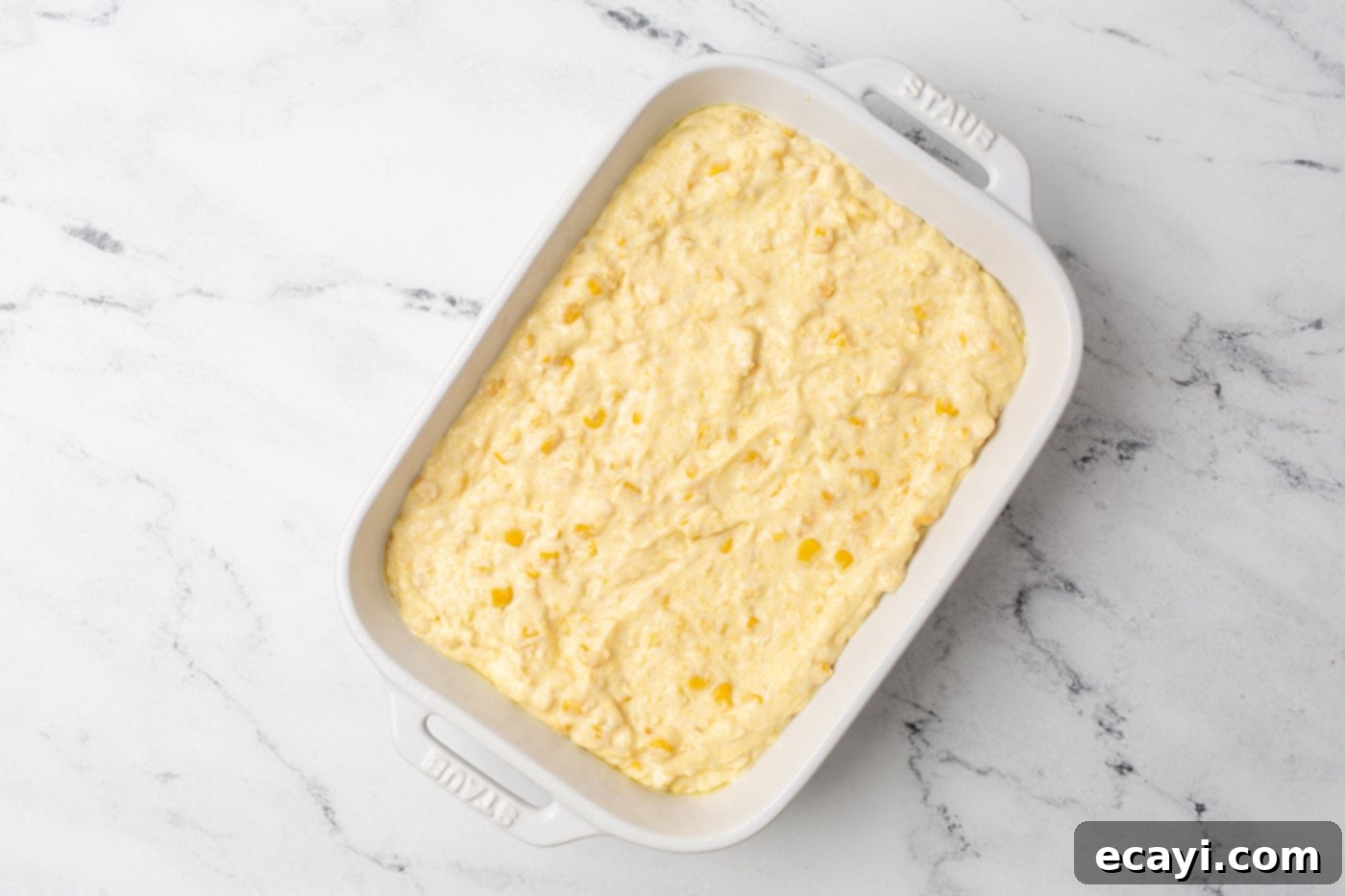 Golden Corn Bake 6 corn casserole ingredients in a baking dish