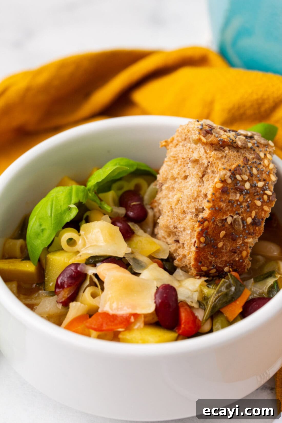 Rustic Italian Minestrone 3 A delicious bowl of Minestrone Soup with a slice of crusty bread on the side, ready to be enjoyed