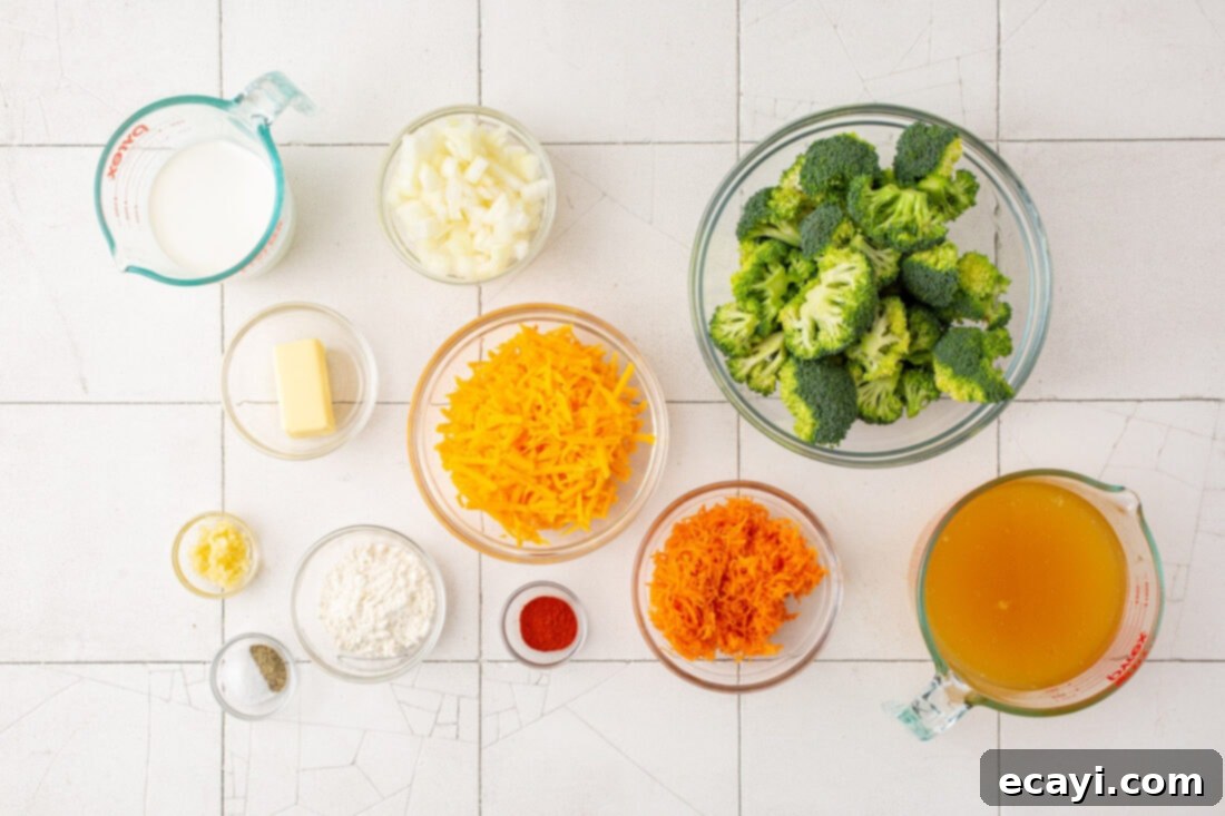 Golden Broccoli Cheddar Delight 4 Fresh ingredients laid out for making broccoli cheese soup, including broccoli florets, carrots, onion, butter, cheese, and seasonings.