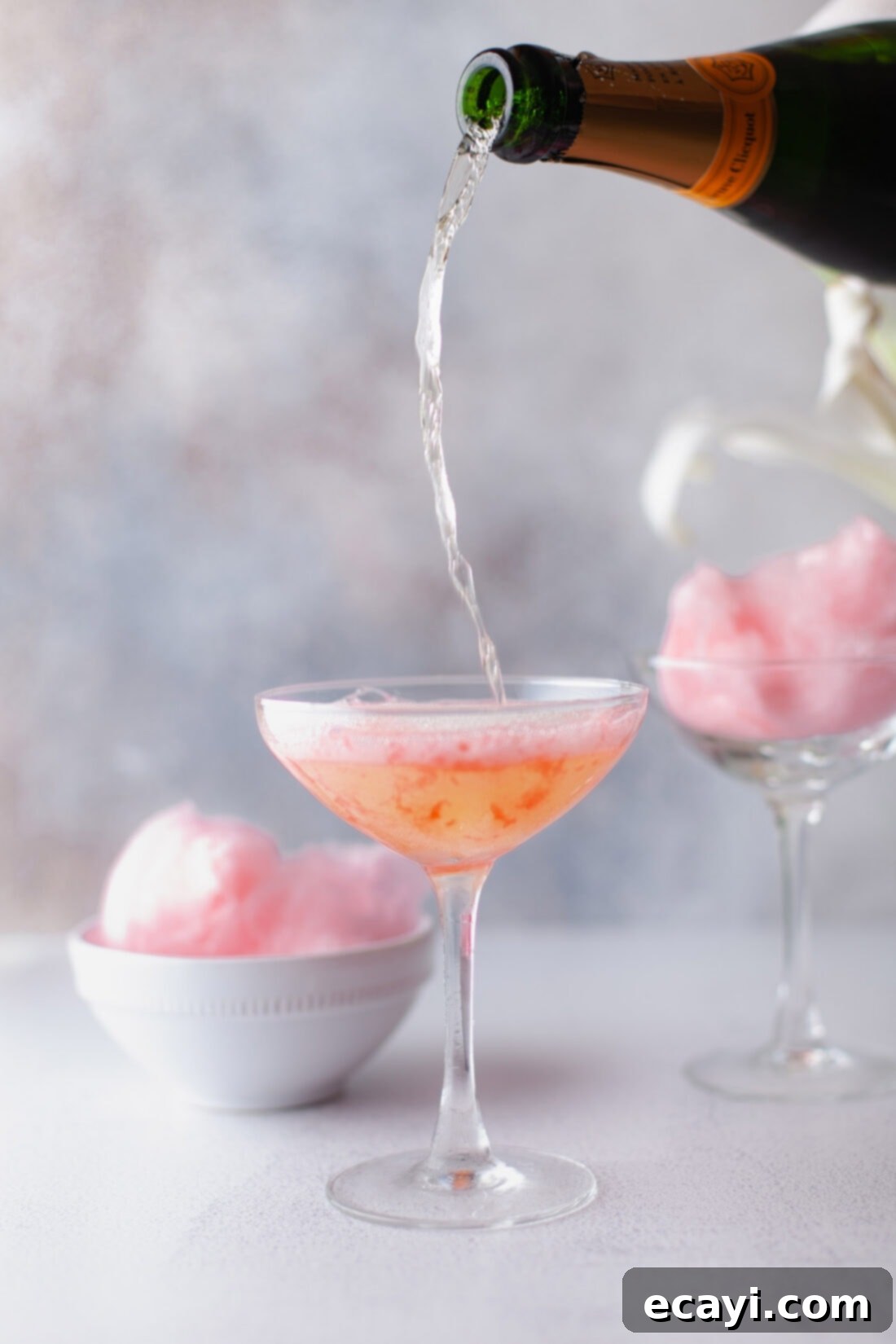 Whimsical Effervescence 7 pouring champagne into a glass with cotton candy, creating a vibrant drink
