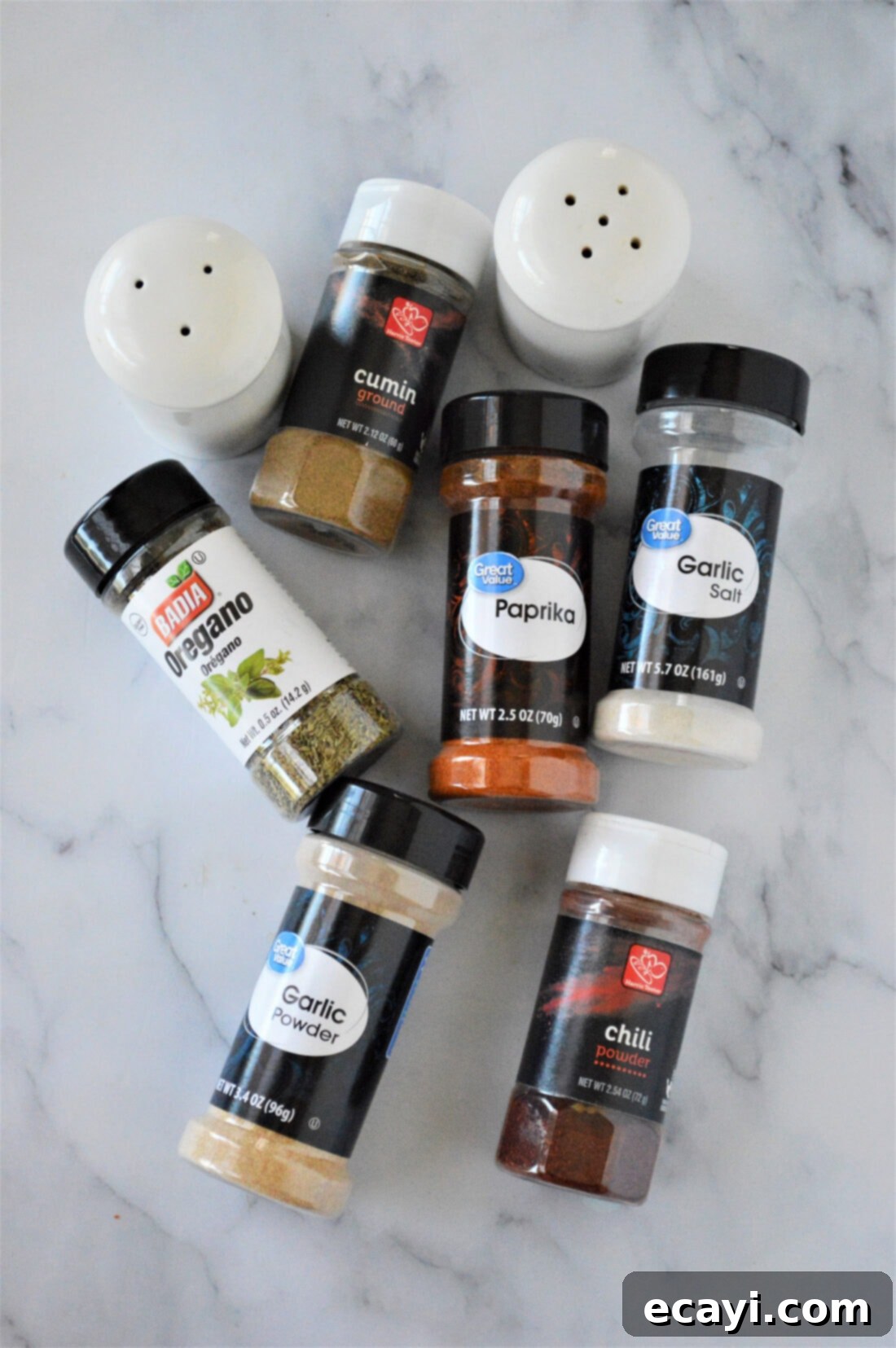 Golden Fry Seasoning 4 All the essential spices and herbs laid out on a kitchen counter, prepped for making the perfect French fry seasoning.