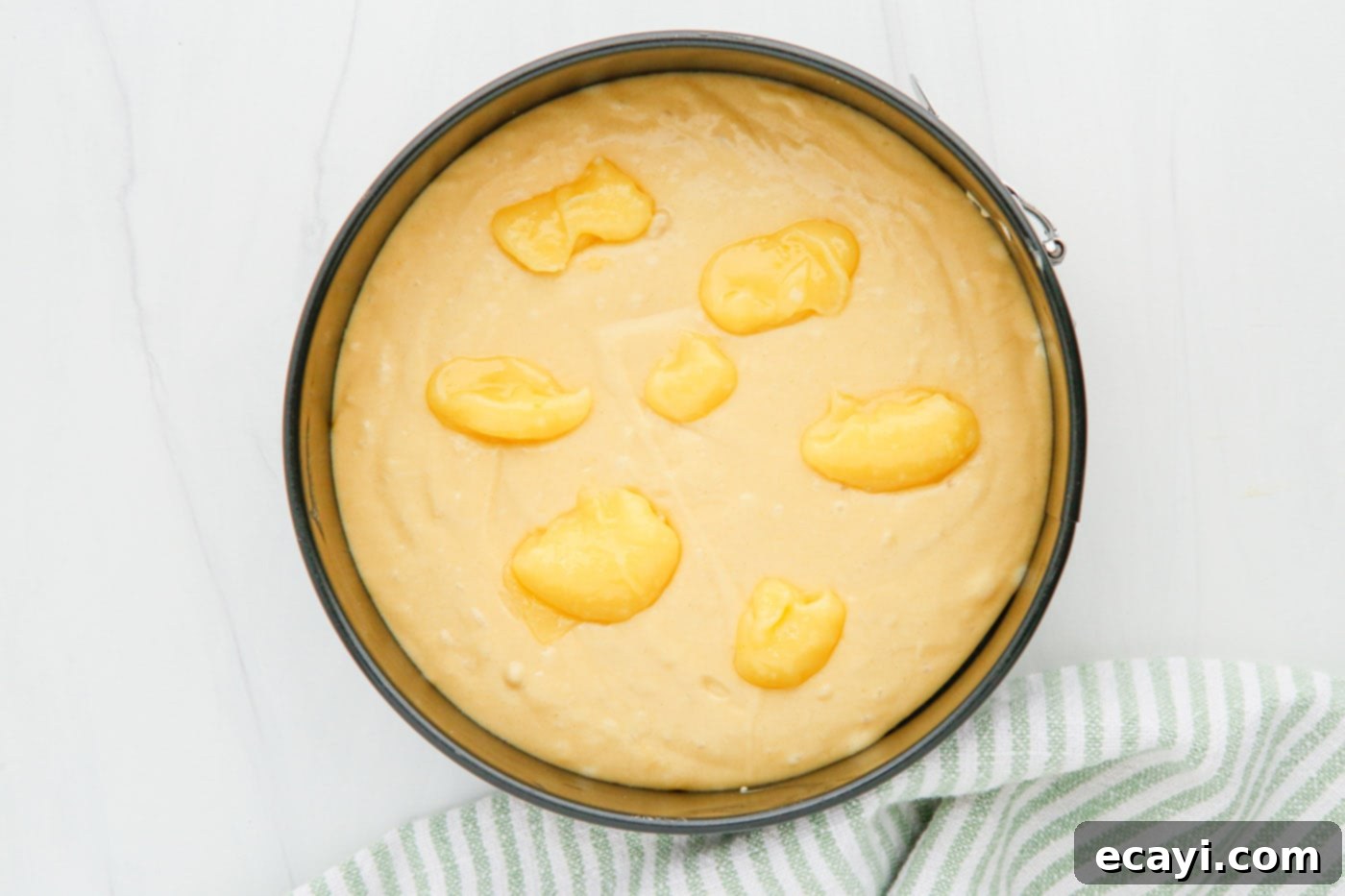 Zesty Instant Pot Lemon Cake 5 lemon curd on top of cake batter