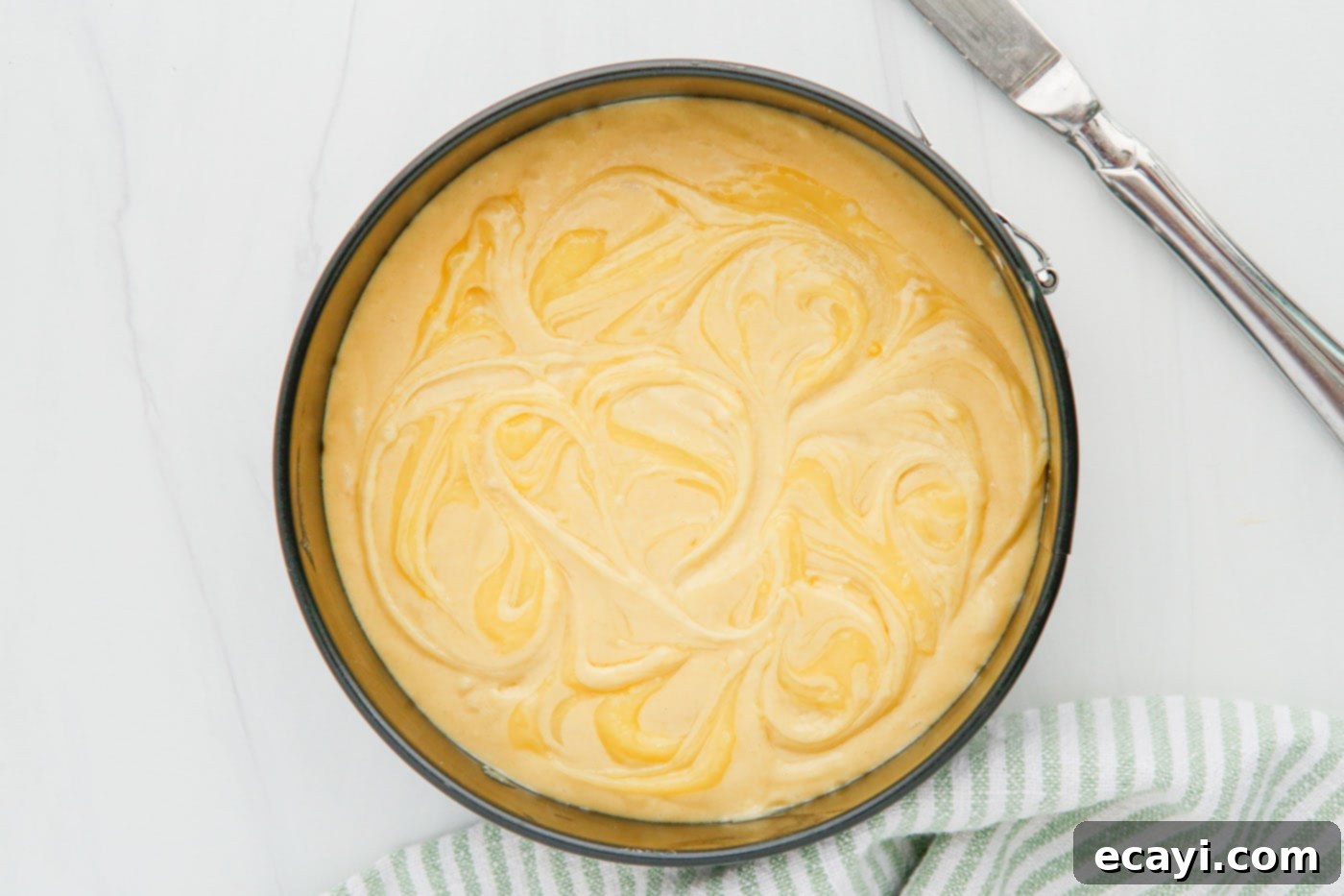 Zesty Instant Pot Lemon Cake 6 swirled lemon curd on top of cake batter