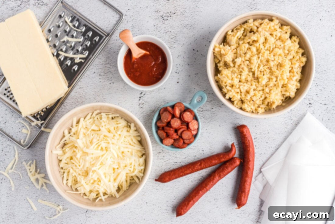 Cauliflower Crust Pizza Bites 4 Ingredients for Cauliflower Pizza Bites: a head of cauliflower, eggs, parmesan, mozzarella, pizza sauce, oregano, garlic powder, salt, and pepperoni