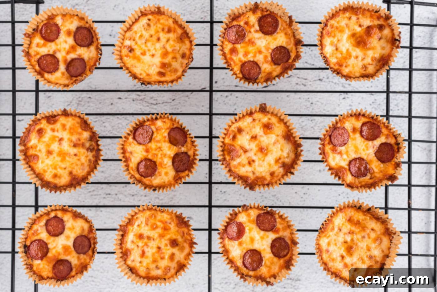 Cauliflower Crust Pizza Bites 10 baked cauliflower pizza bites cooling on a wire rack