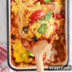 Cheesy Chicken Enchilada Bake 14 A delicious Chicken Enchilada Casserole, garnished with fresh cilantro, ready to be served.