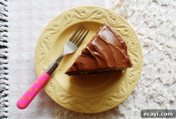 Timeless Yellow Cake: Celebrating Life and Memories A perfectly baked classic yellow cake with rich chocolate frosting, a centerpiece for reflection and celebration.