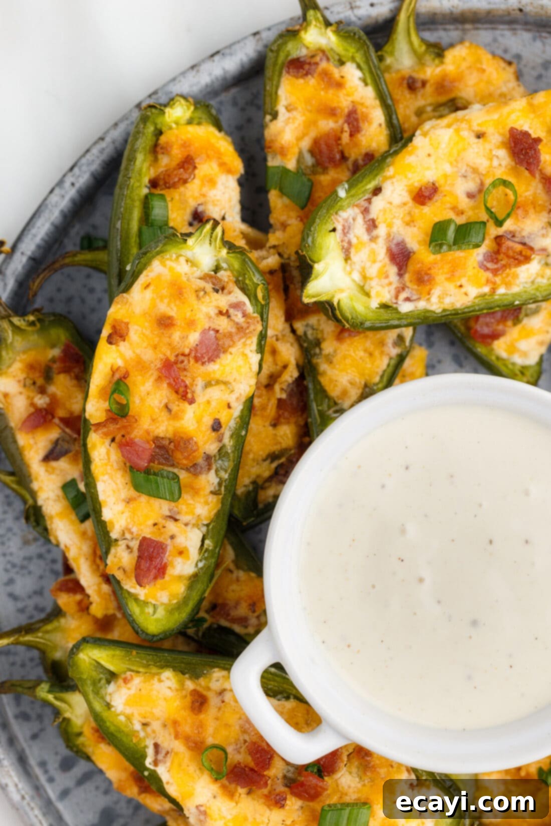 Golden Jalapeño Delights 2 Baked Jalapeño Poppers with a creamy dipping sauce on the side