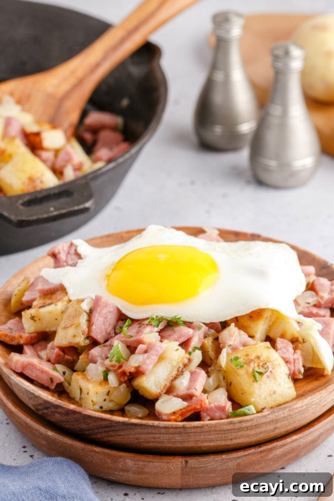 Crispy Corned Beef Hash 3 Perfectly cooked fried egg resting on a generous serving of Corned Beef Hash