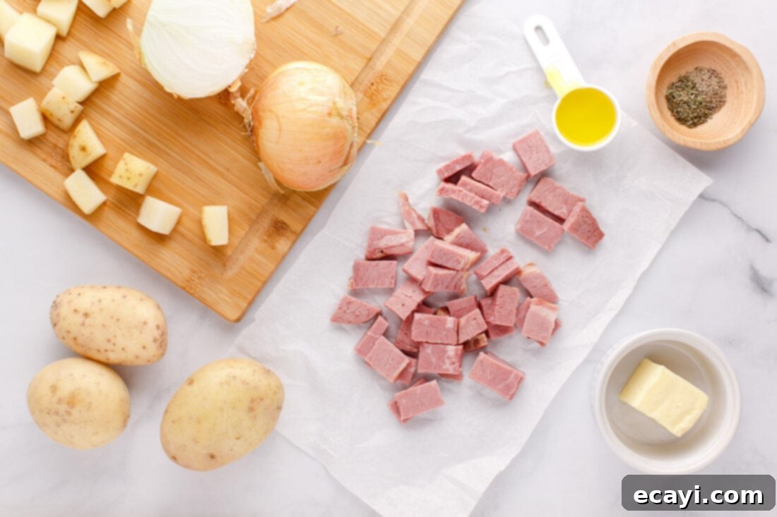 Crispy Corned Beef Hash 4 Assortment of fresh ingredients laid out for making Corned Beef Hash, including potatoes, corned beef, and onions