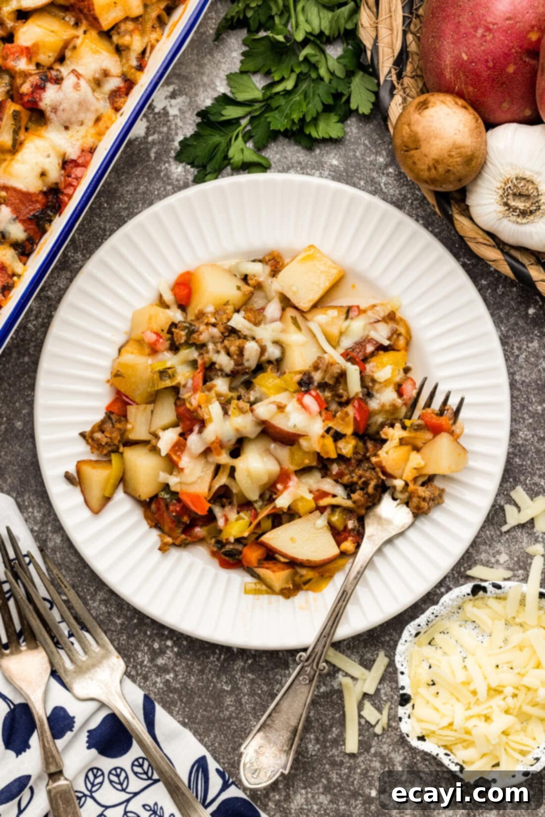 Hearty Sausage and Potato Bake 2 Plate of Sausage and Potato Casserole with a fork on the side
