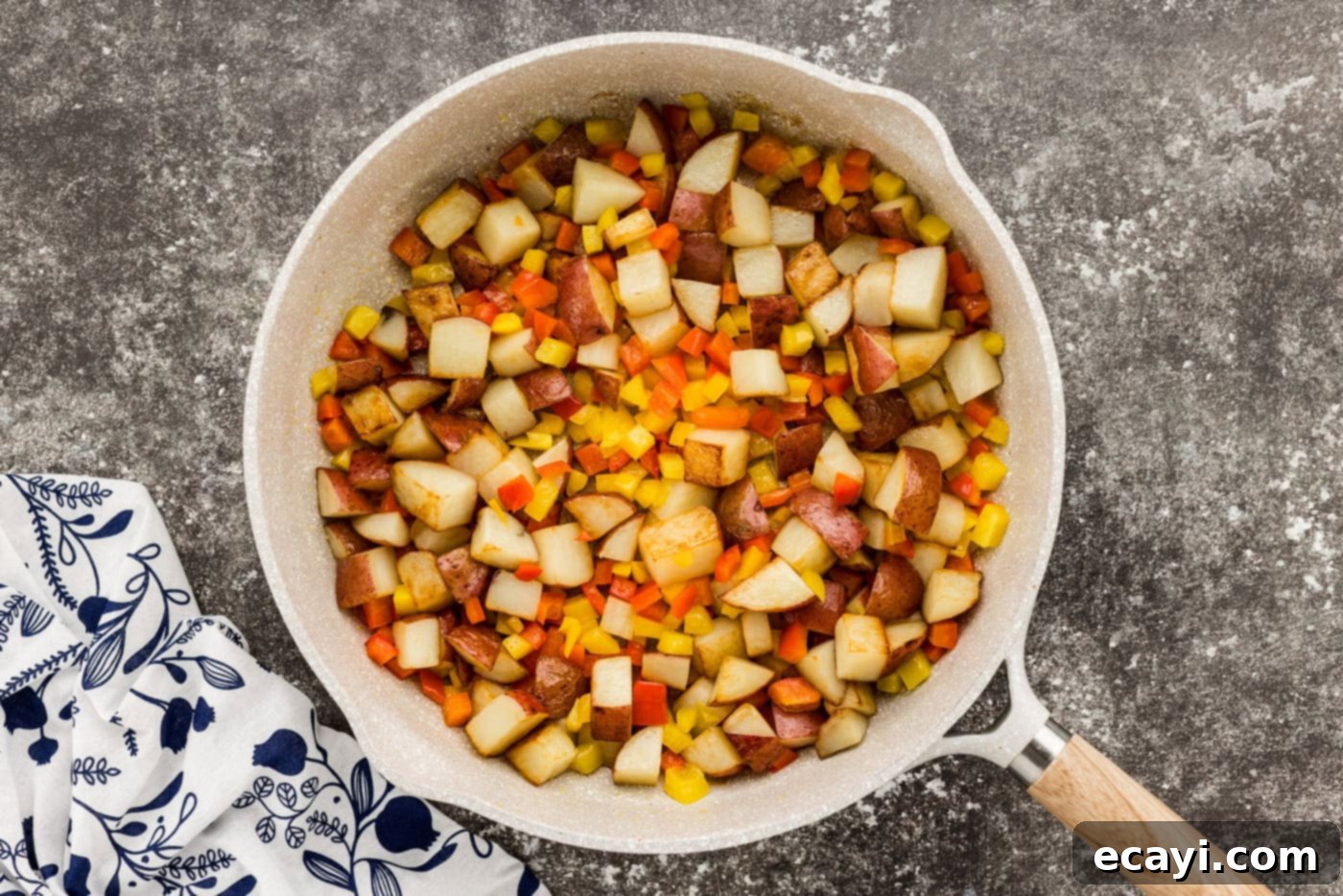 Hearty Sausage and Potato Bake 7 sausage with peppers and potatoes in a skillet
