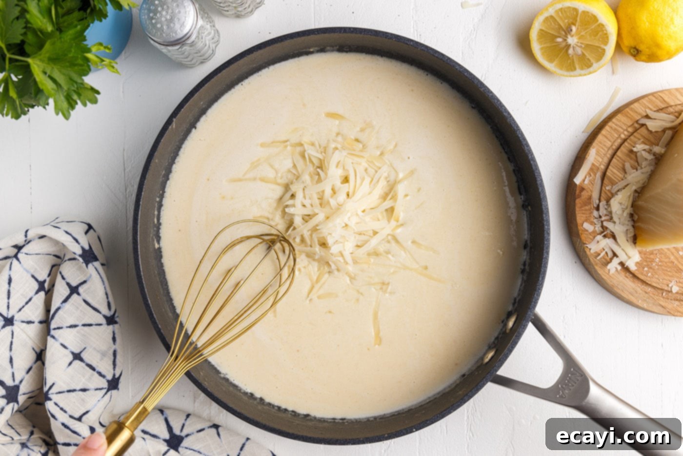 Creamy Garlic Shrimp Pasta 12 Whisking Freshly Grated Parmesan into Creamy Lemon Garlic Pasta Sauce
