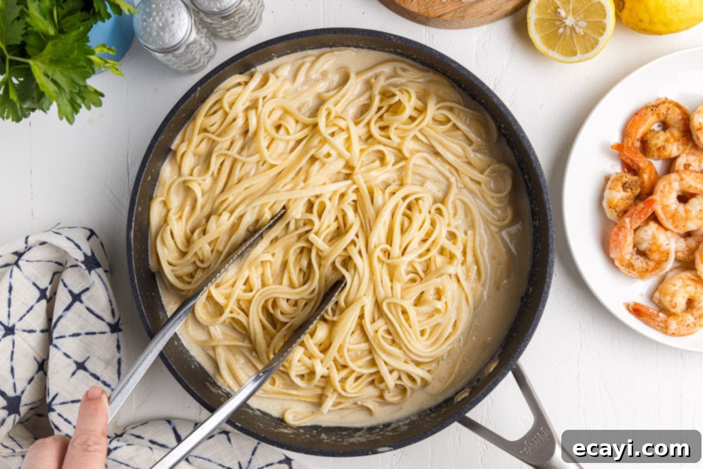 Creamy Garlic Shrimp Pasta 14 Tossing Cooked Linguine Noodles in Creamy Lemon Garlic Sauce
