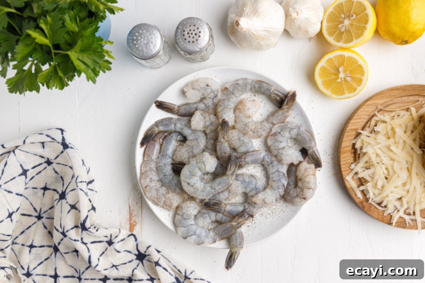 Creamy Garlic Shrimp Pasta 6 Salt and Pepper Seasoned Raw Shrimp on a Plate
