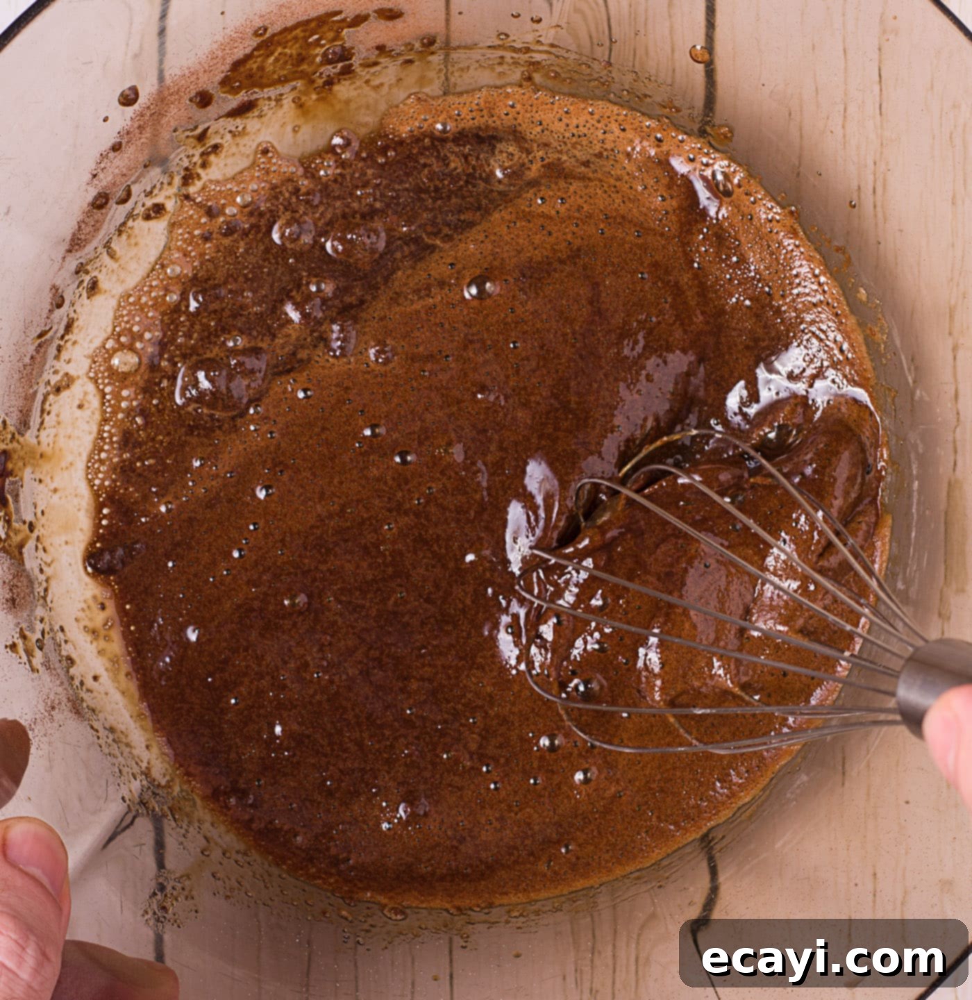 Whipped Coffee Sensation 5 whisking instant coffee, water, and sugar in a bowl