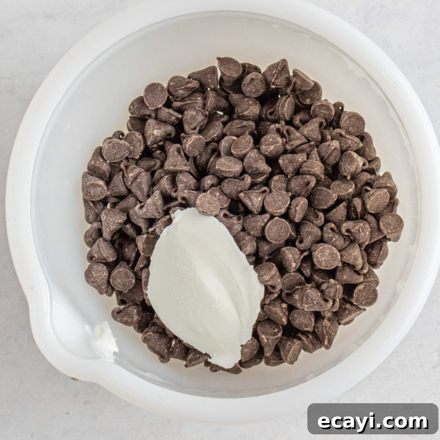 Rich Chocolate Pound Cake 10 chocolate chips and crisco in a bowl