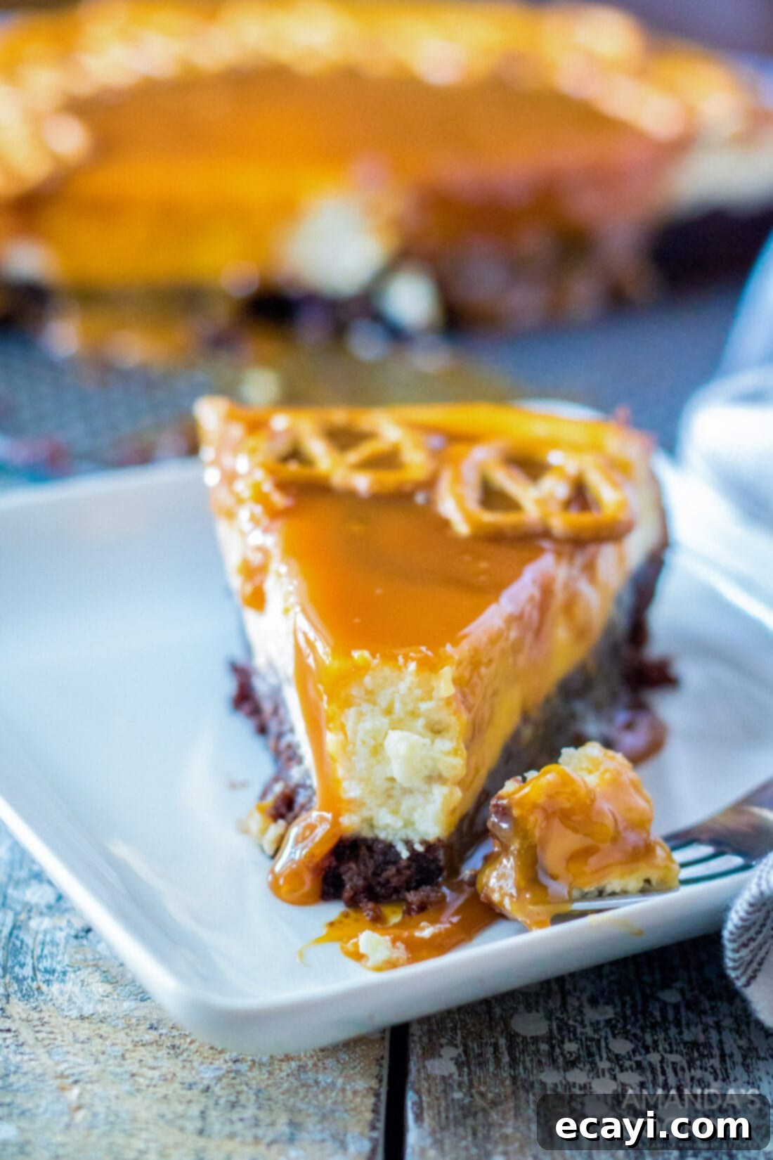 Salted Caramel Cheesecake 2 slice of Salted Caramel Cheesecake with bite out of it