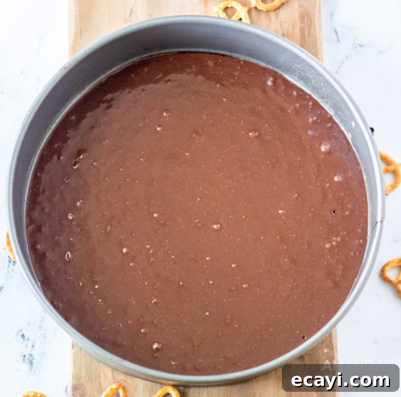 Salted Caramel Cheesecake 5 brownie mix in a springform pan