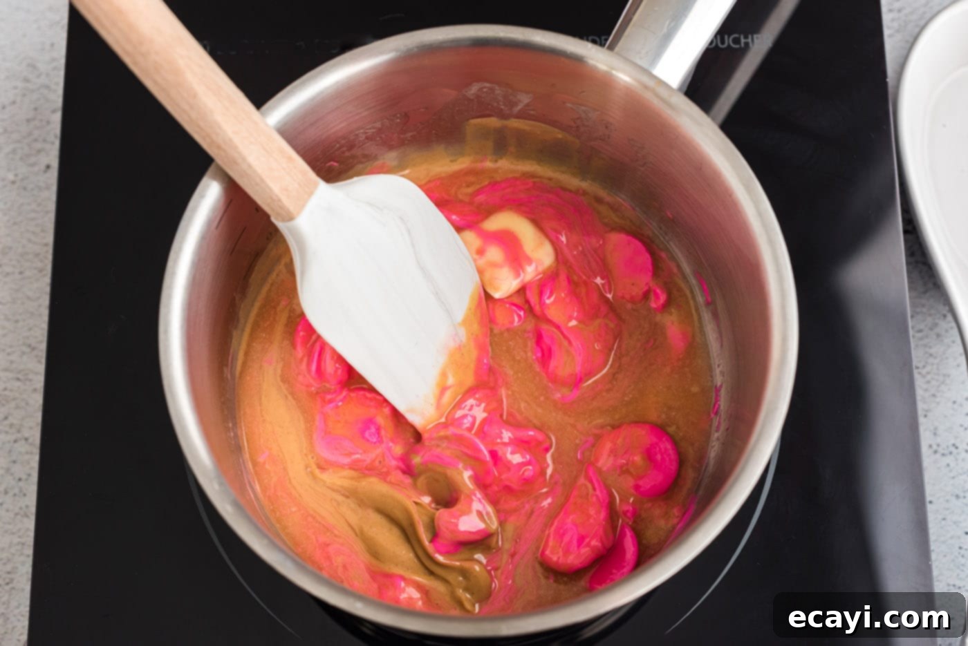 Sweetheart Muddy Buddies 5 rubber spatula stirring pink candy melts with peanut butter