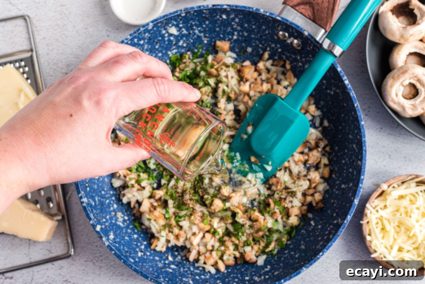 Gourmet Mushroom Poppers 6 Pouring white Vermouth into the pan with onions and herbs, creating a fragrant steam.