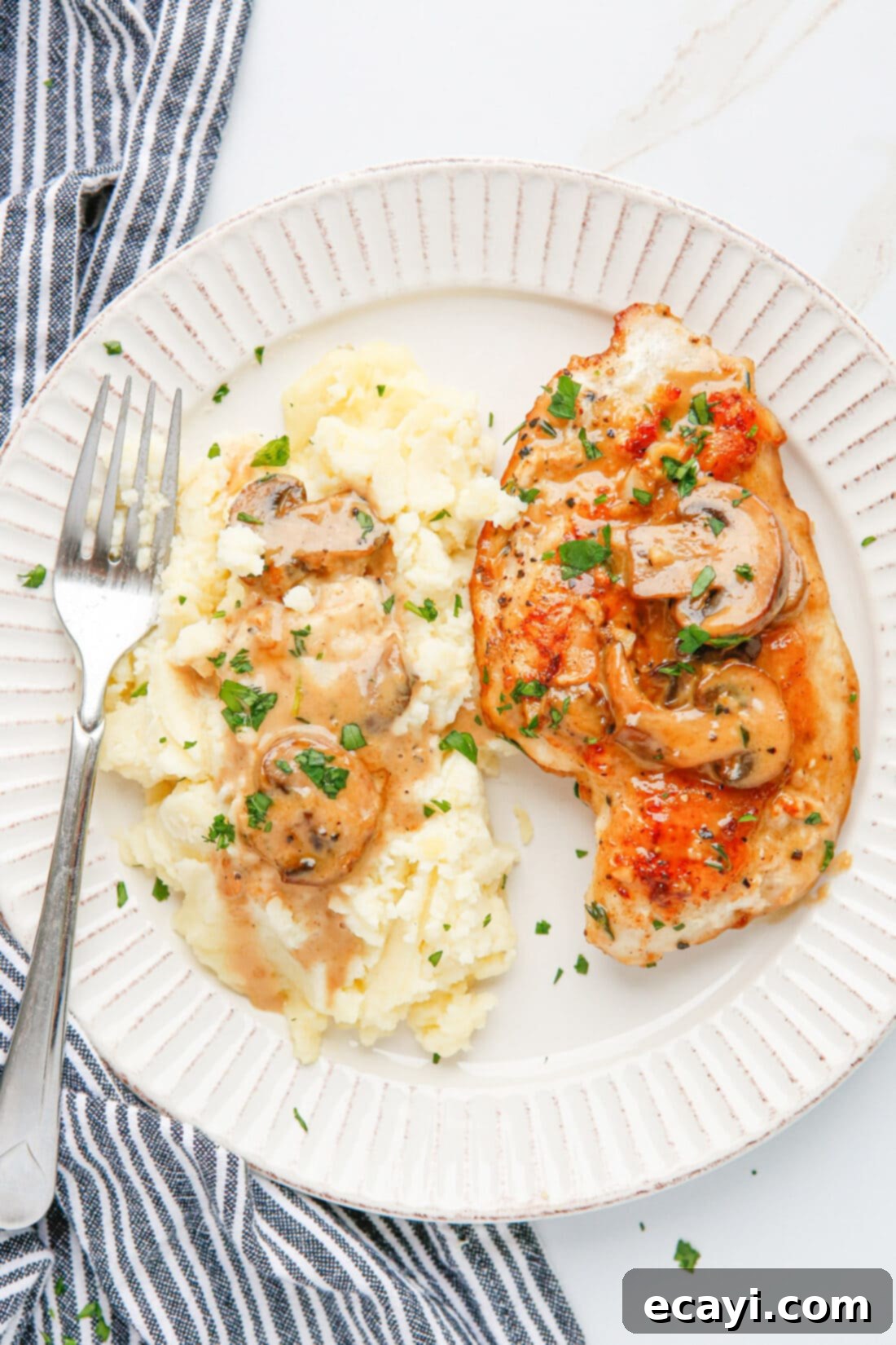 Savory Chicken Marsala 3 Chicken Marsala on a plate with mashed potatoes and green beans
