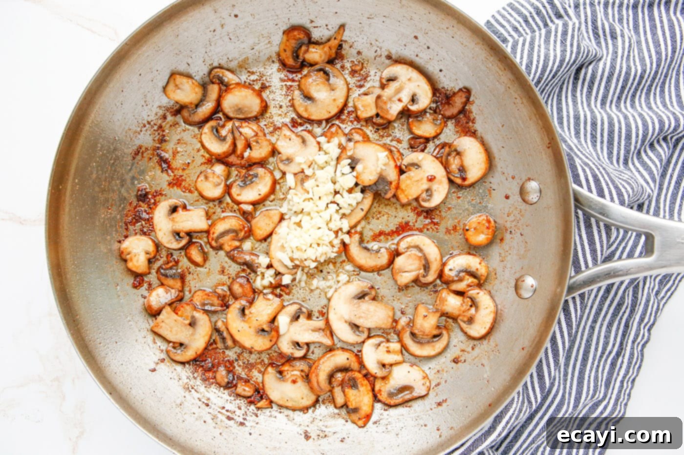 Savory Chicken Marsala 8 Sautéed mushrooms with minced garlic in a skillet