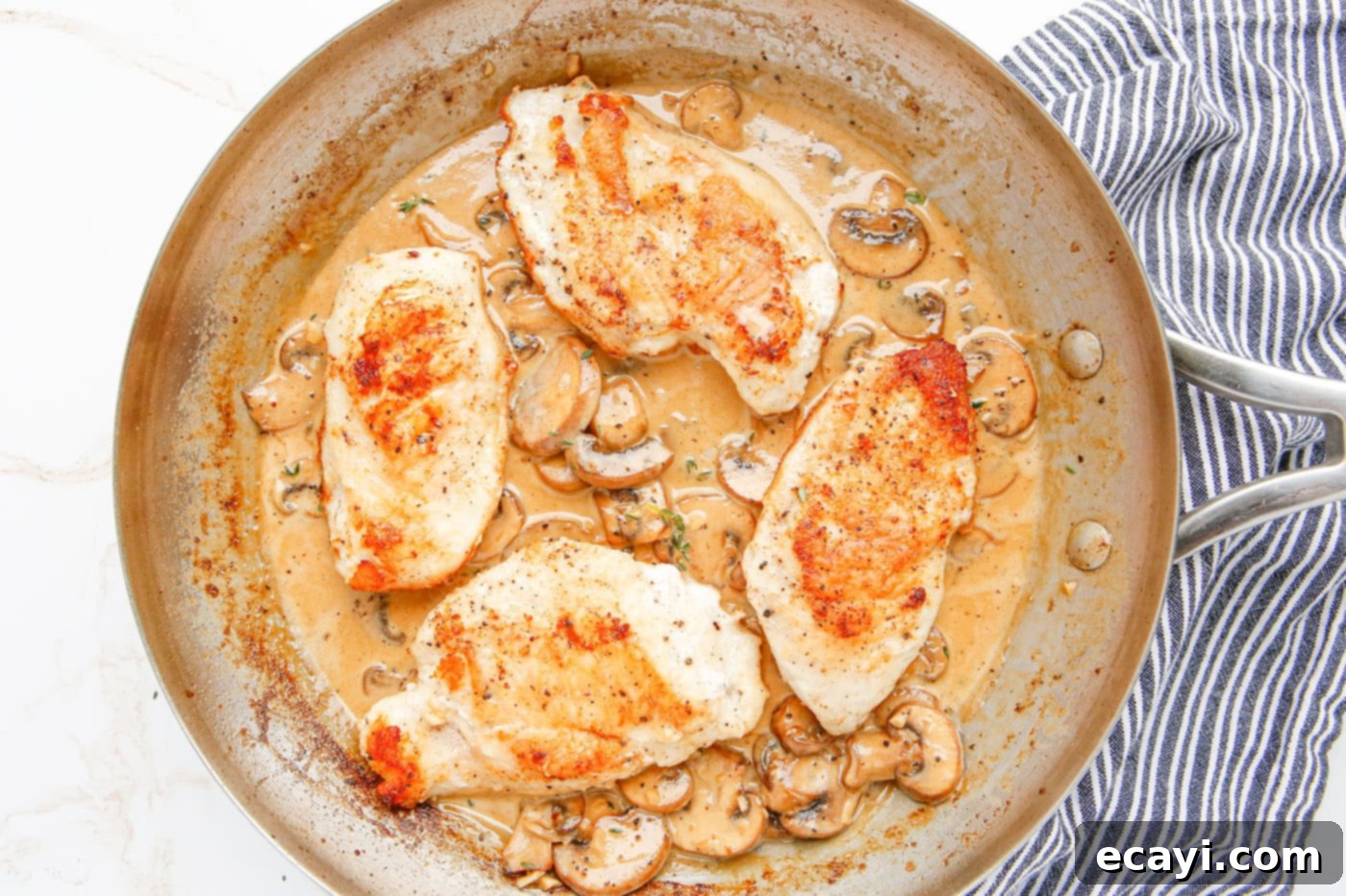 Savory Chicken Marsala 10 Finished pan-fried Chicken Marsala in a skillet, ready to serve