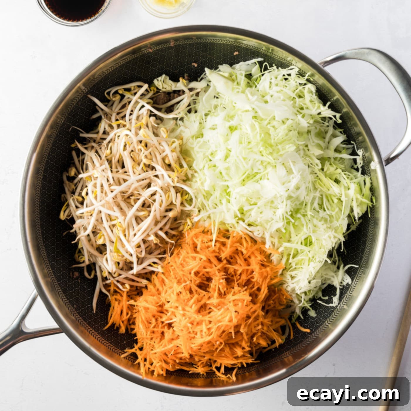 Egg Roll Stir-Fry Bowl 6 Shredded cabbage, carrots, and mung bean sprouts added to the skillet with meat and aromatics