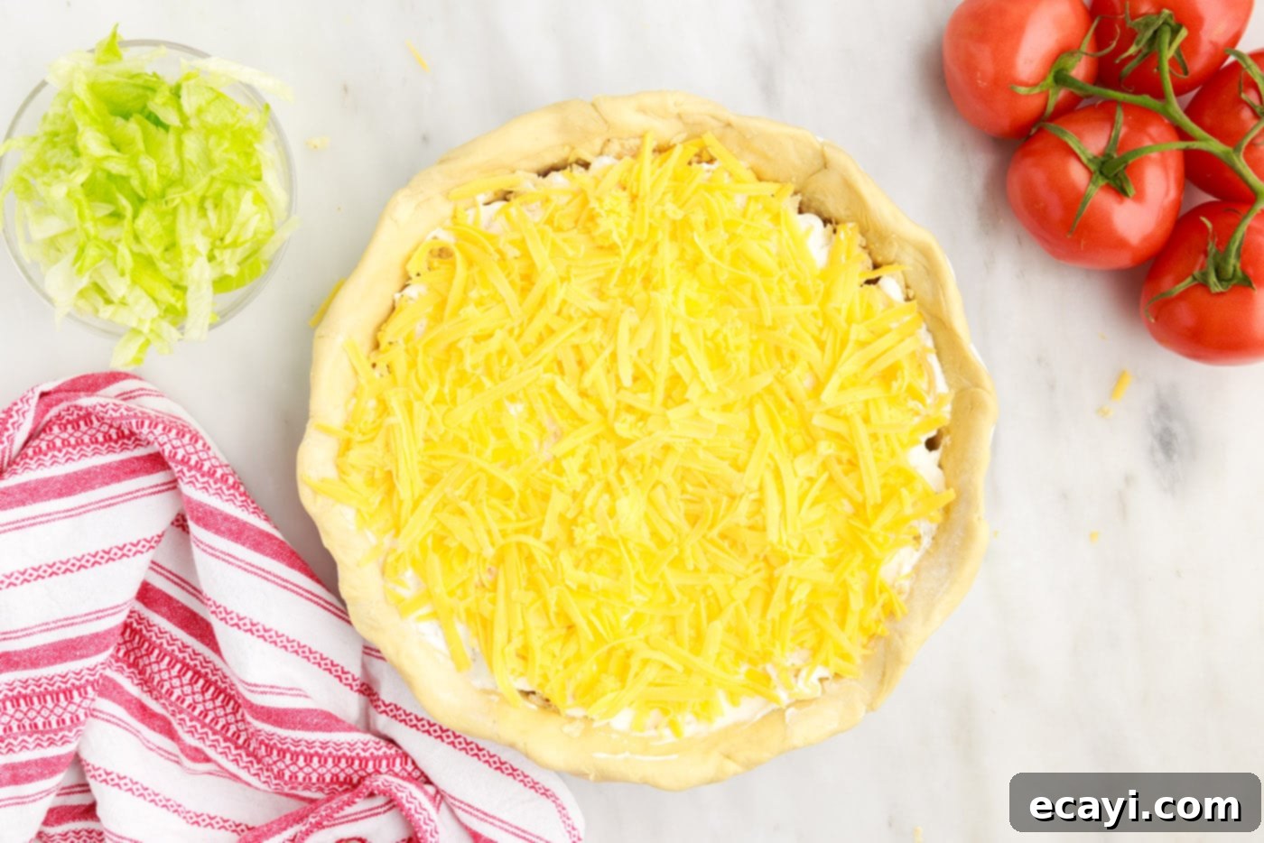 Ultimate Taco Casserole 12 layer of shredded cheese on taco pie
