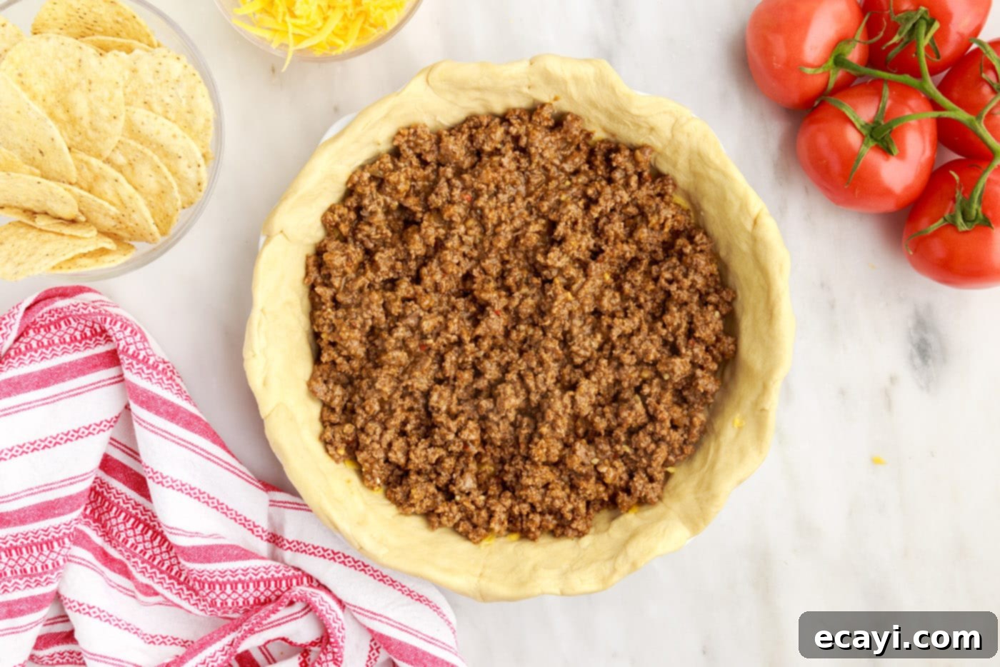 Ultimate Taco Casserole 8 ground beef on top of crescent roll crust