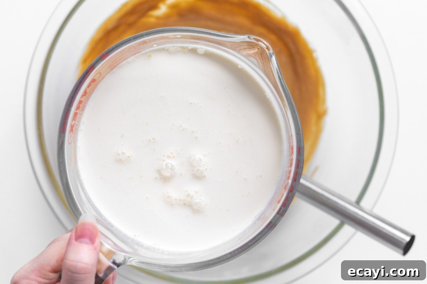 Peanut Butter Chocolate Chip Dream 6 Pouring heavy whipping cream mixture over peanut butter mixture