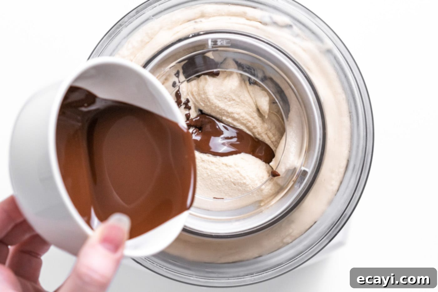 Peanut Butter Chocolate Chip Dream 8 Pouring melted chocolate in a thin stream into churning peanut butter ice cream