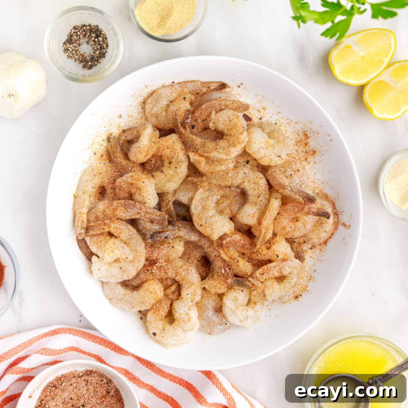 Crispy Air Fryer Shrimp 8 seasoned shrimp on a plate