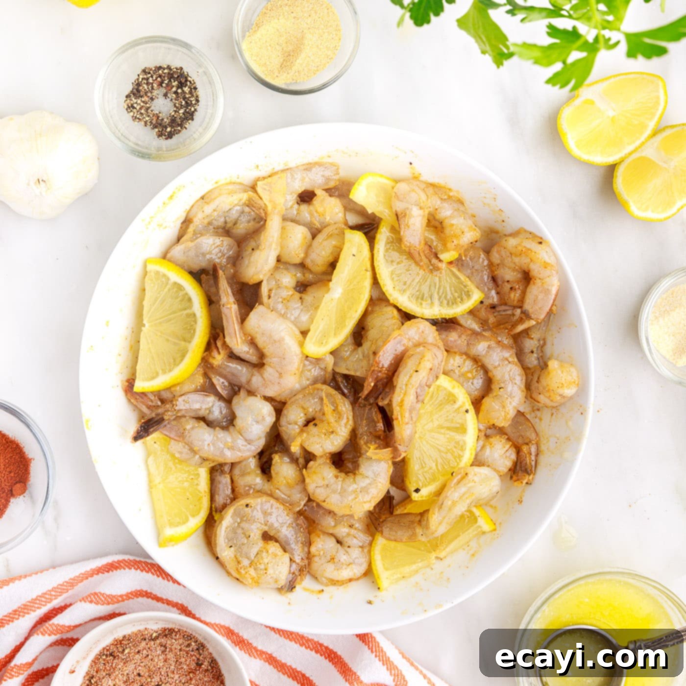 Crispy Air Fryer Shrimp 9 lemon wedges mixed into raw shrimp