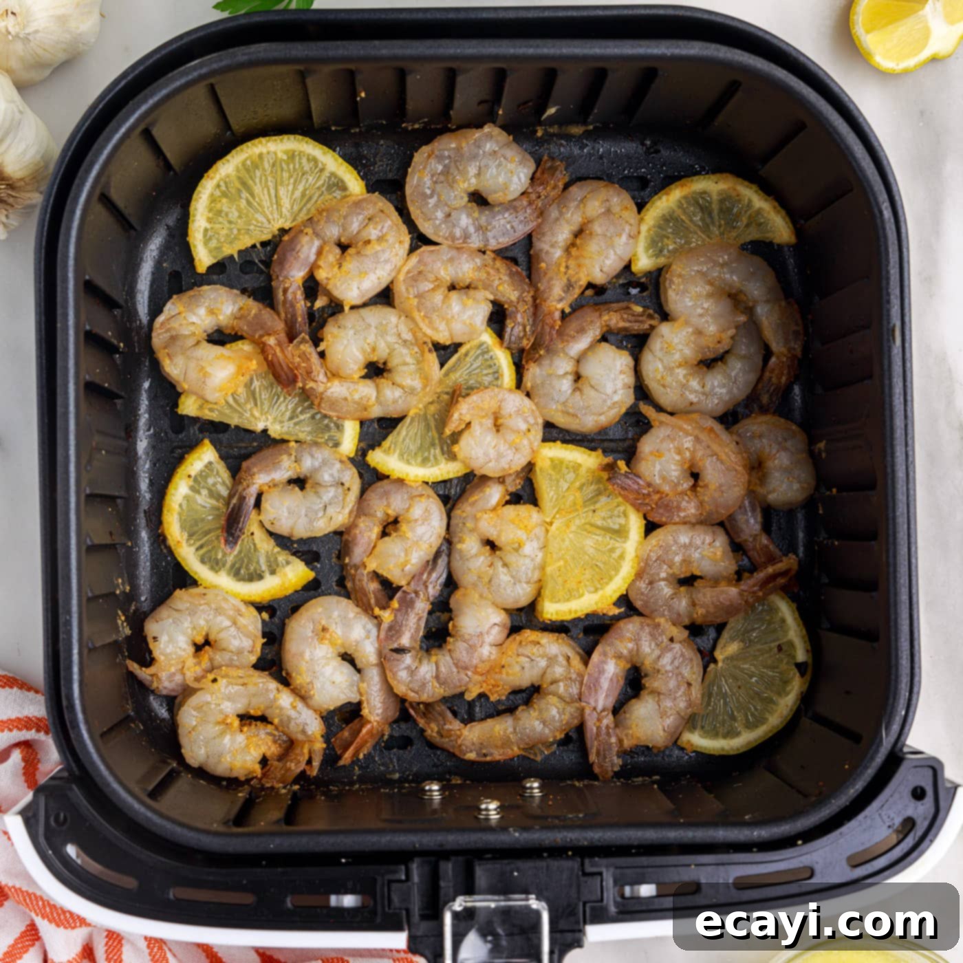 Crispy Air Fryer Shrimp 10 raw shrimp in the air fryer with lemon