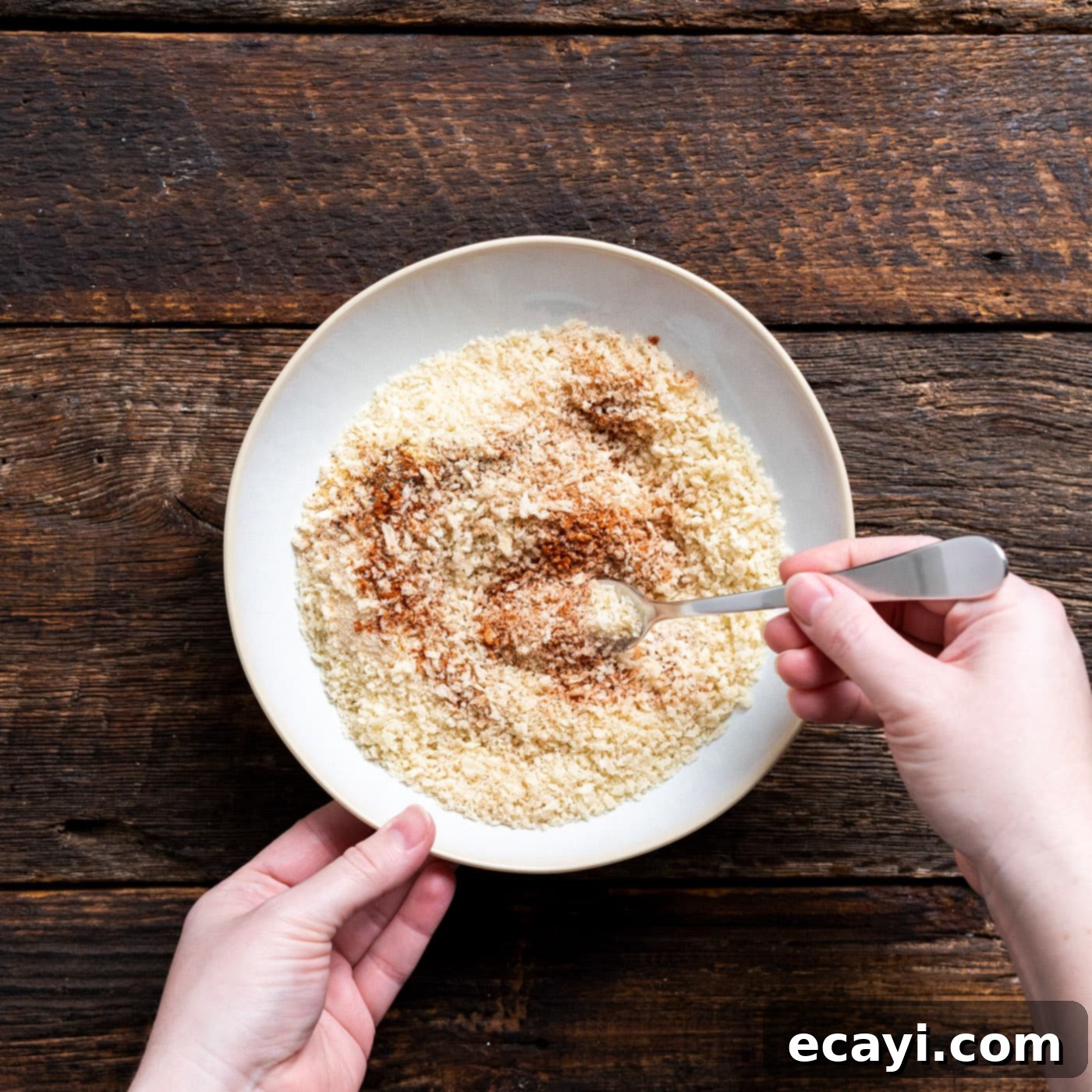 Effortless Air Fryer Fish Perfection 5 seasonings mixed with breadcrumbs in a bowl