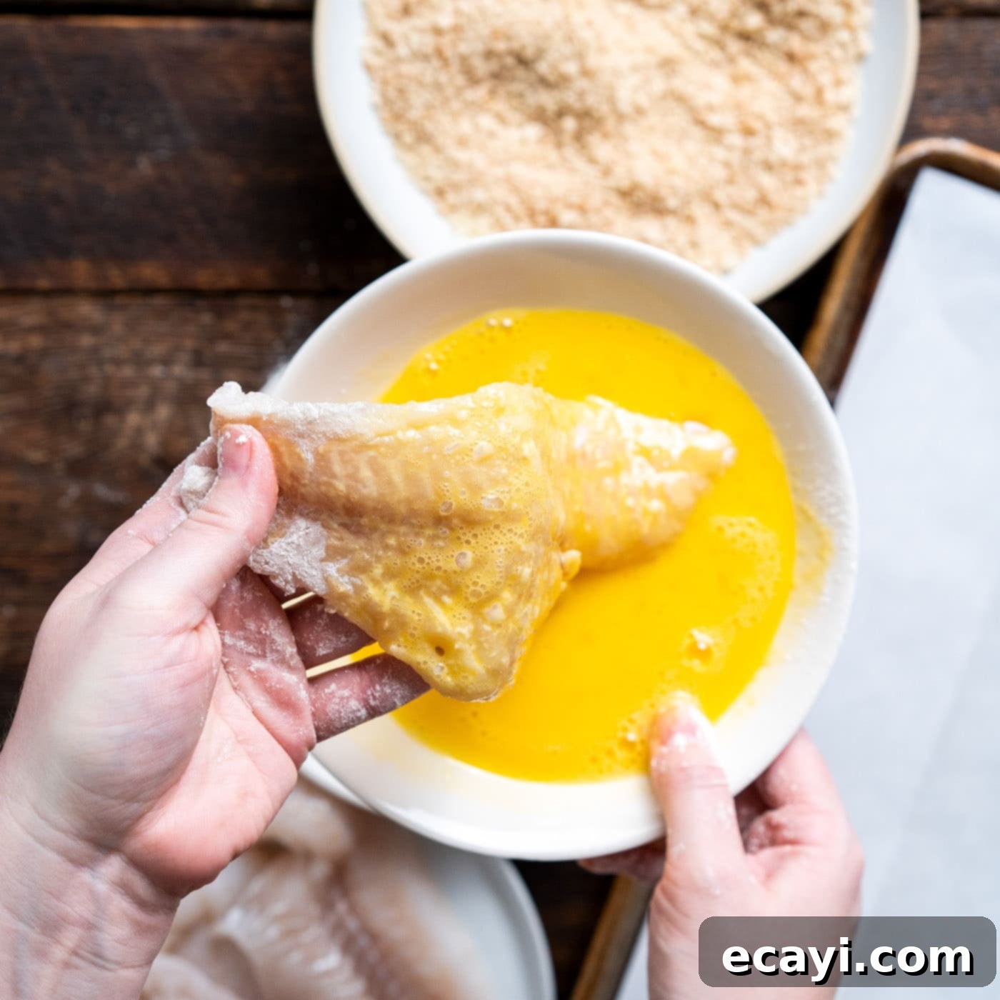 Effortless Air Fryer Fish Perfection 7 dipping cod into egg