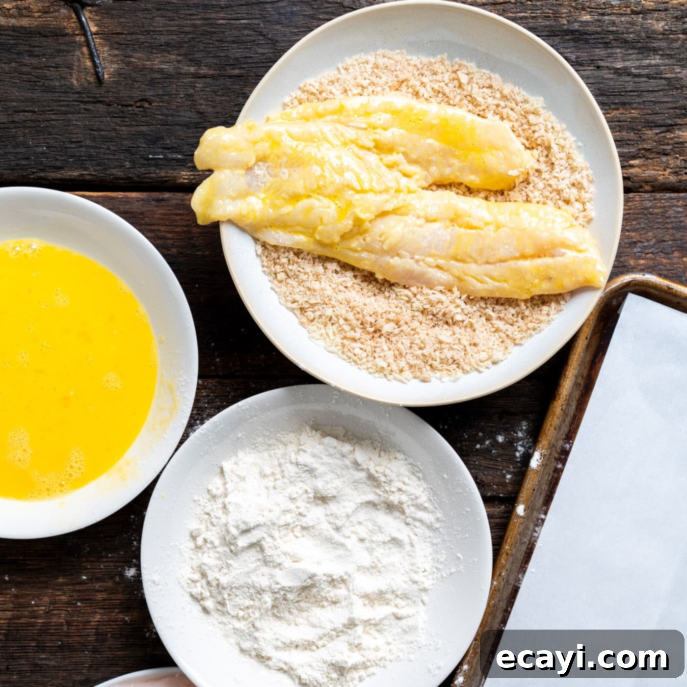 Effortless Air Fryer Fish Perfection 8 dipping cod fillets into panko breadcrumbs