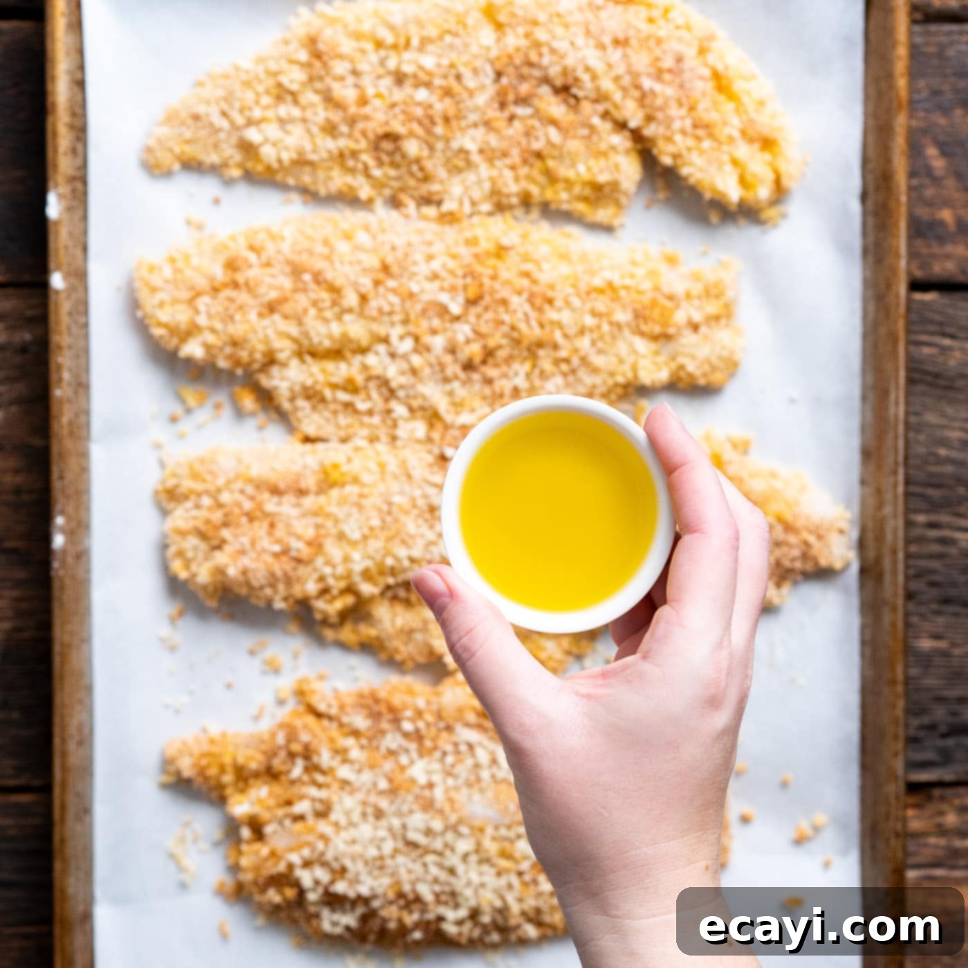 Effortless Air Fryer Fish Perfection 9 drizzling olive oil over fish fillets