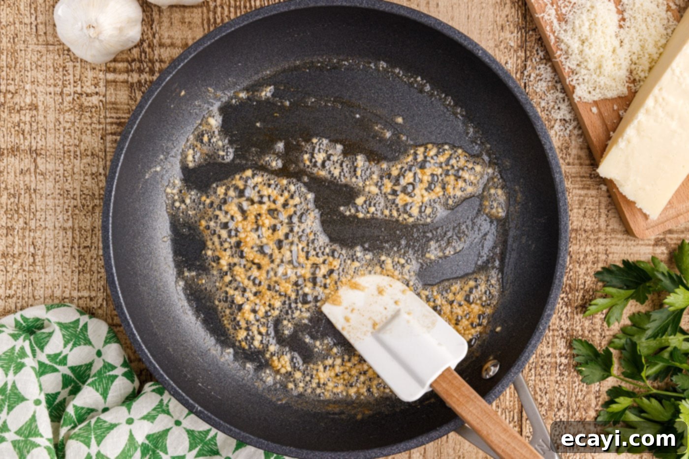 Authentic Pasta Carbonara 6 sauteeing minced garlic in a skillet