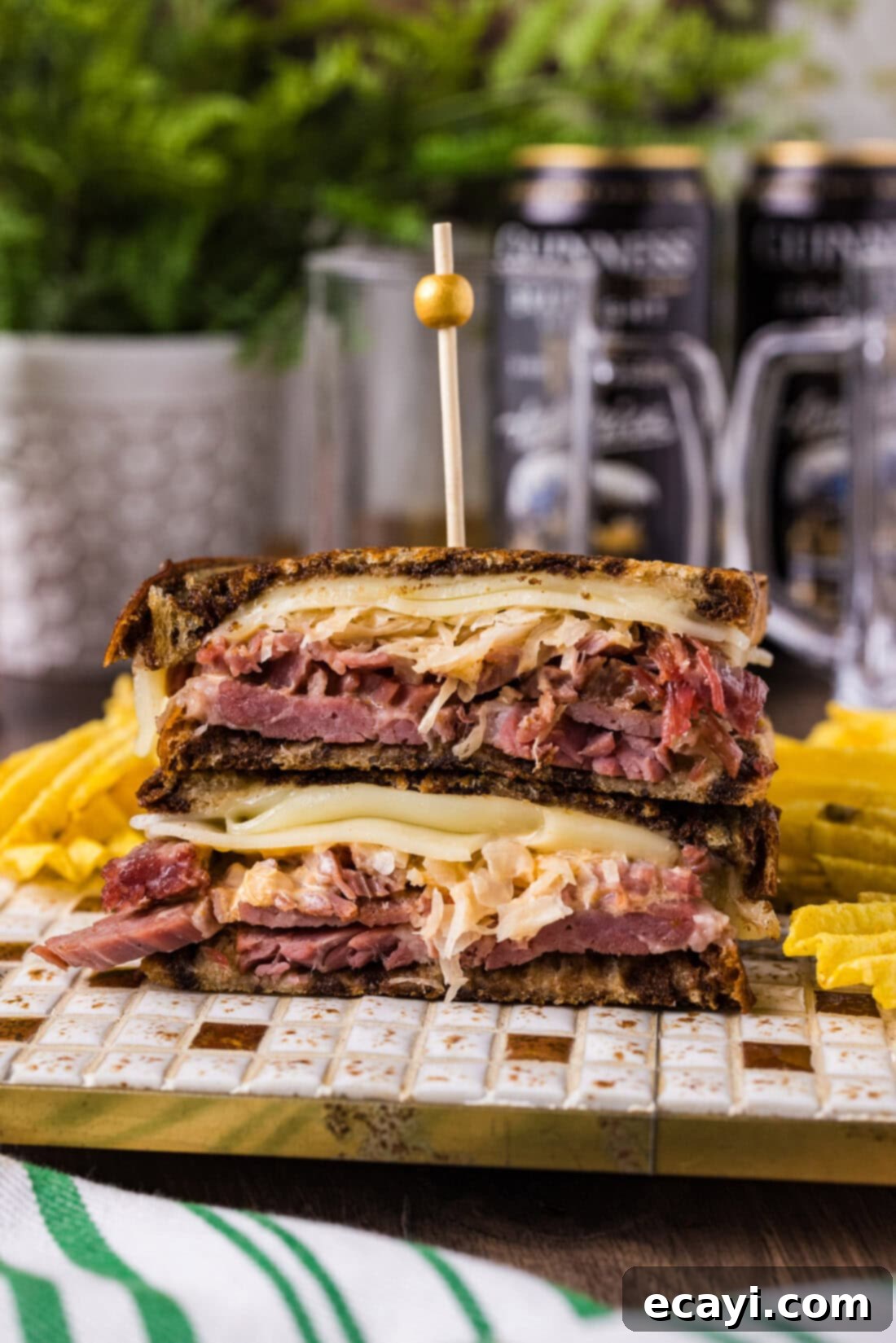 Classic Reuben Sandwich 2 A delicious Reuben Sandwich on a plate with potato chips, ready to be enjoyed.