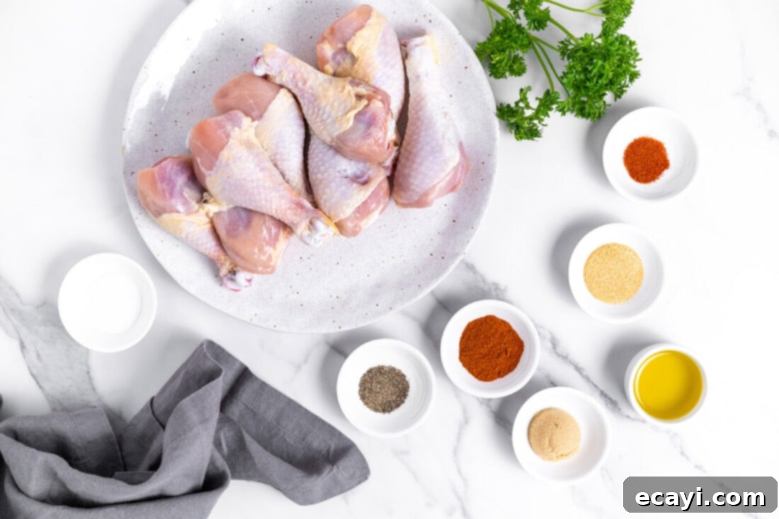 Golden Crispy Air Fryer Drumsticks 4 A bowl of chicken drumsticks with spices and olive oil, ready for mixing