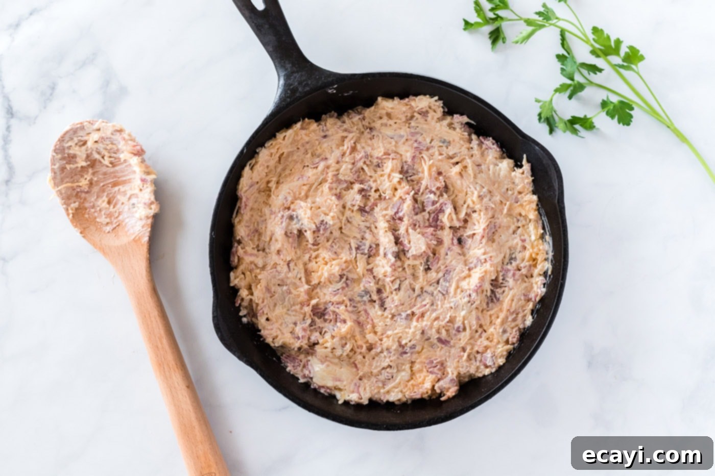 Decadent Reuben Dip 7 Reuben dip baking in a skillet